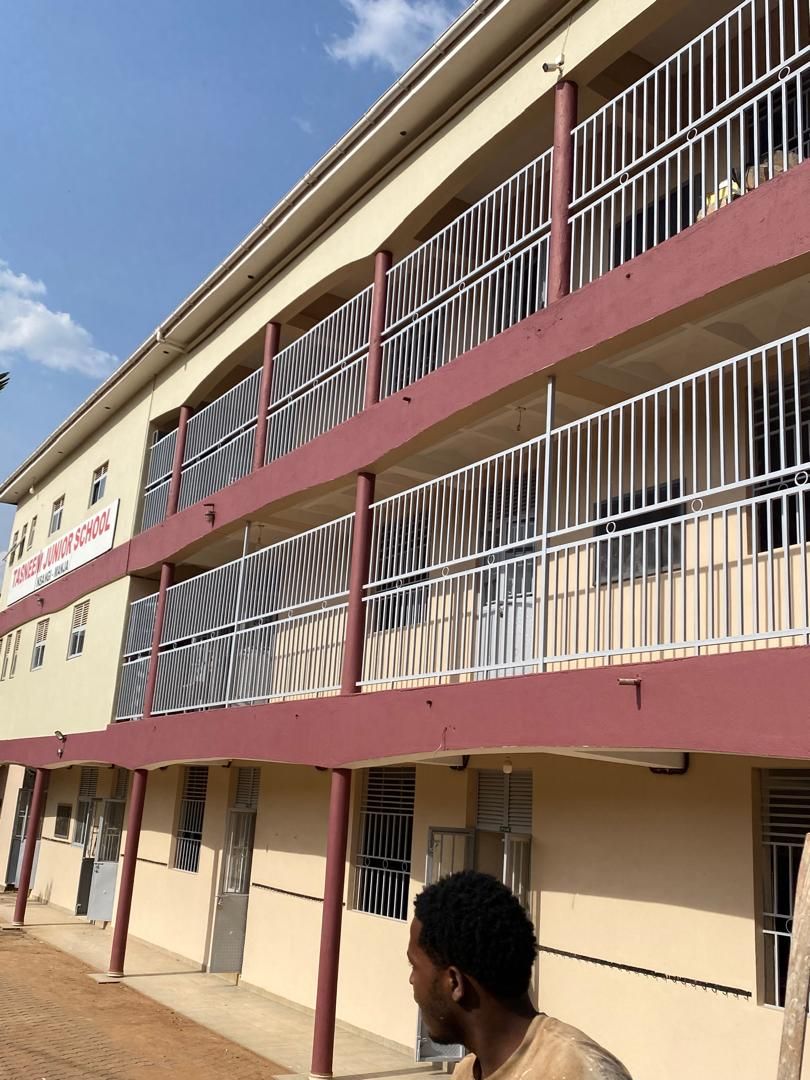 Tasneem Junior School institutional building painted by Dizat