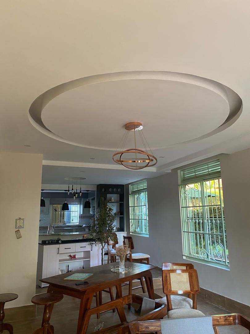 Elegant dining room ceiling detail painted in soft neutral tones